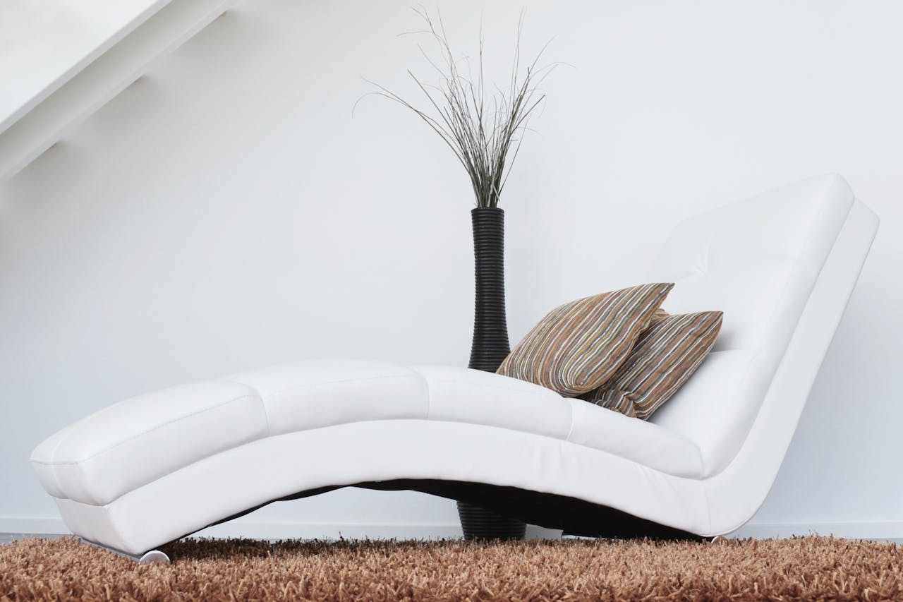A design white leather fainting couch